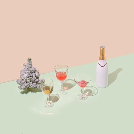 Christmas tree with champagne bottle and glasses