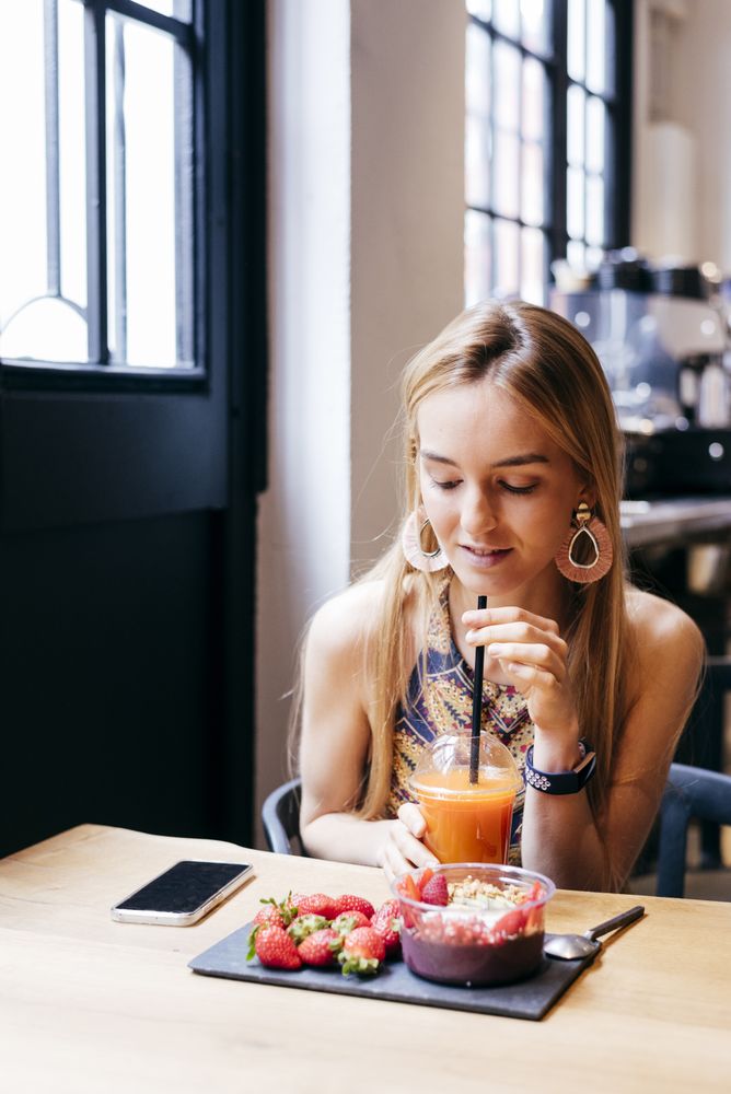 Blonde woman enjoying lunch