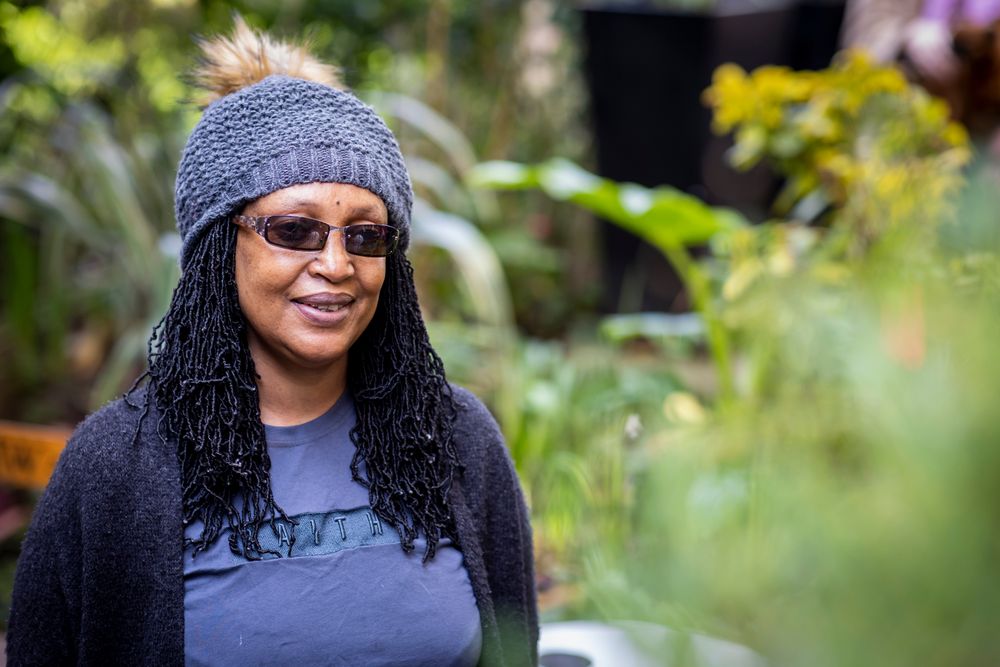 Portrait of older Black woman outside in woolen hat