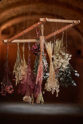 Bunches of withered flowers on frame
