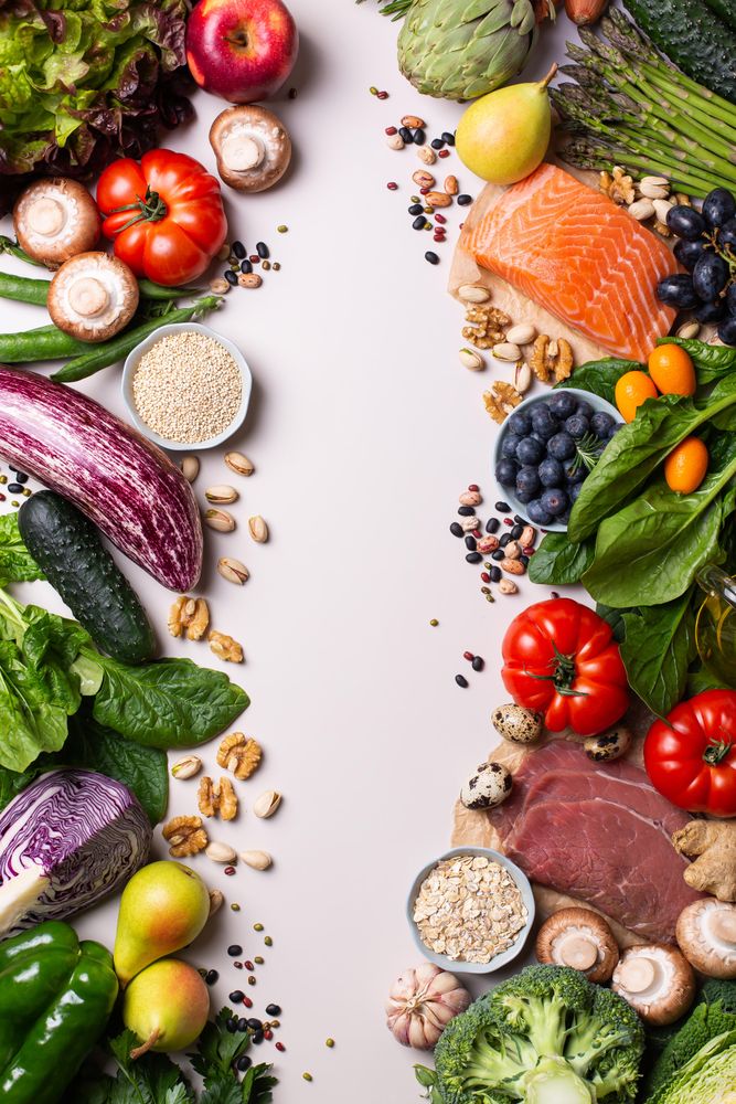 Assortment of healthy food ingredients for cooking with copy space in center of picture, vertical