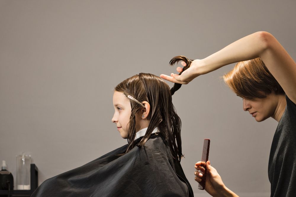 Child client sitting in hair salon