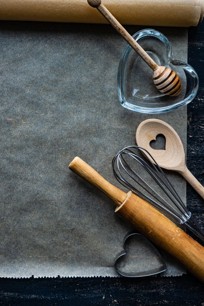 St. Valentine day card baking concept with heart shaped utensils