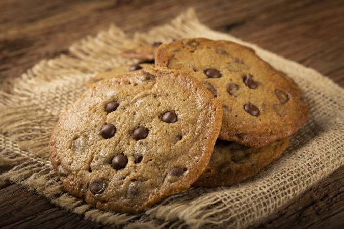 Delicious chocolate cookies on wooden table.