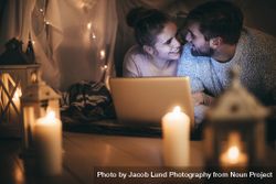 Romantic couple on bed with a laptop 48Bdoj