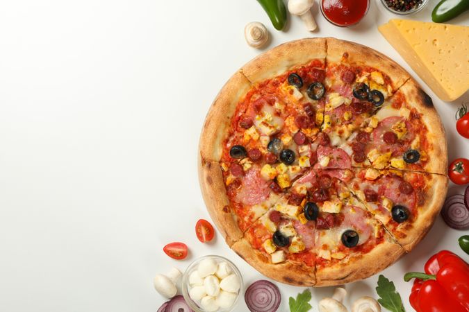 Tasty pizza with meat and ingredients on plain background