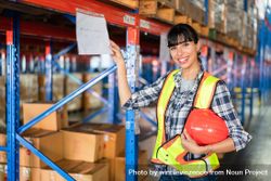 Factory woman working in warehouse 0vN2B0