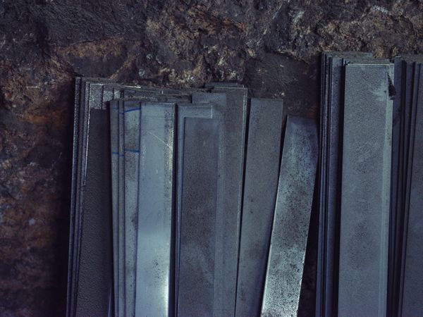 Bunch of metal sheets in forge workshop