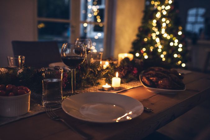 Festive christmas table place setting at home