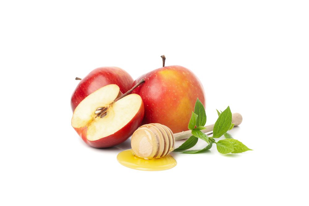 Apple half and honey dipper