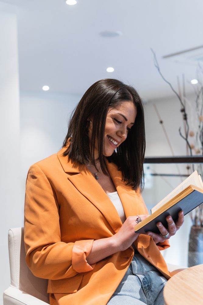 Woman reading book in cafe