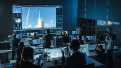 Space Mission Control Room Monitors Rocket Launch.