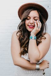 Woman closing eyes standing in white background