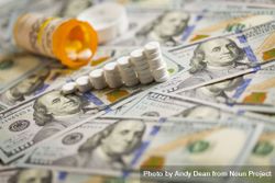 Medicine Pills Stacked on Newly Designed One Hundred Dollar Bills 0V6r8r
