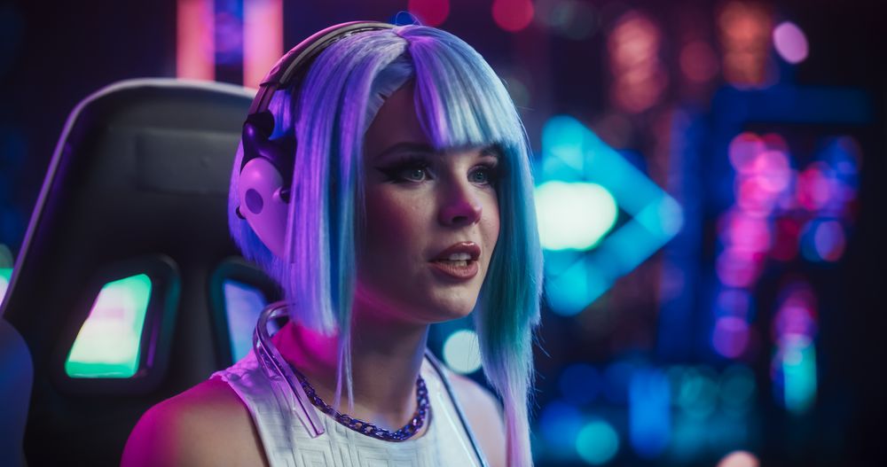 Stylish Streamer or Video Gamer Chatting with Internet Fans in Futuristic Cyberpunk Studio