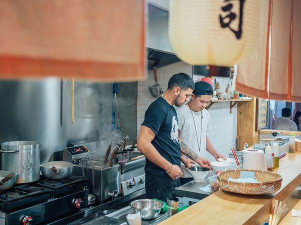 Kitchen staff in Asian cafe