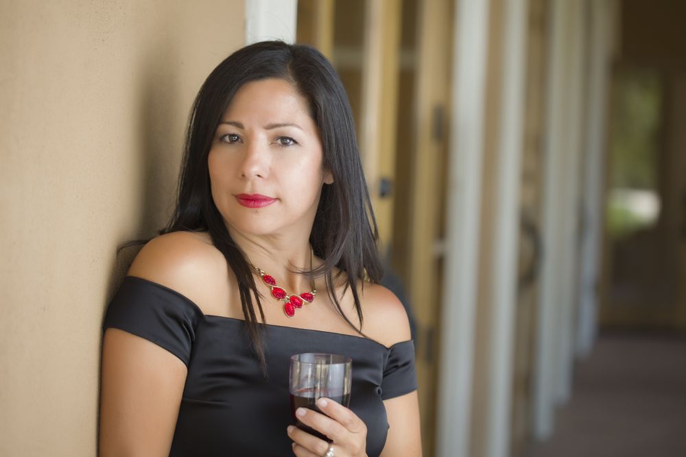 Hispanic Woman Portrait Outside Enjoying Wine
