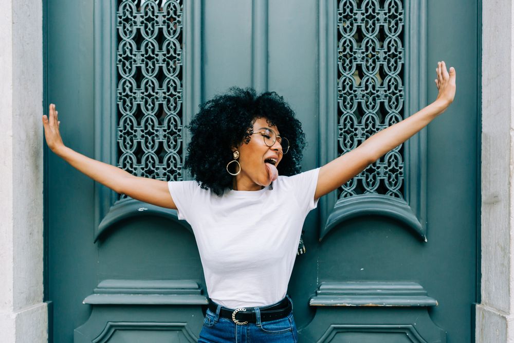 Stylish Black female with outstretched arms