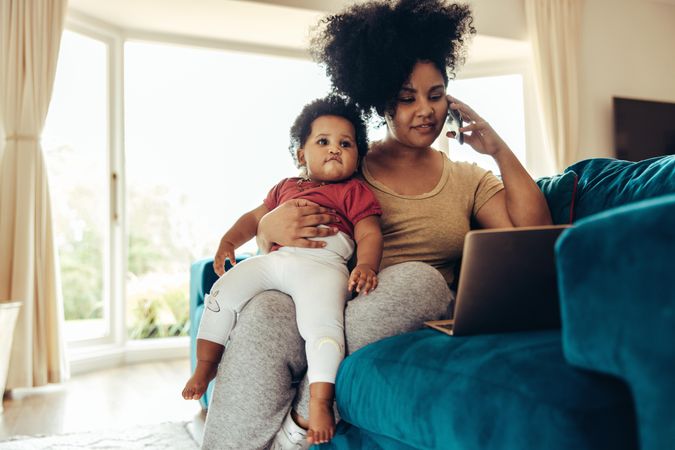 Mother working from home and caring for her child
