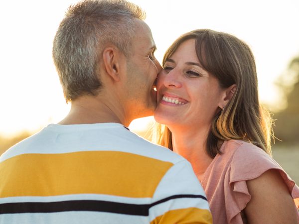 Adult couple embracing near sea