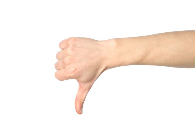 Male hand thumb down, isolated on plain background. Gestures