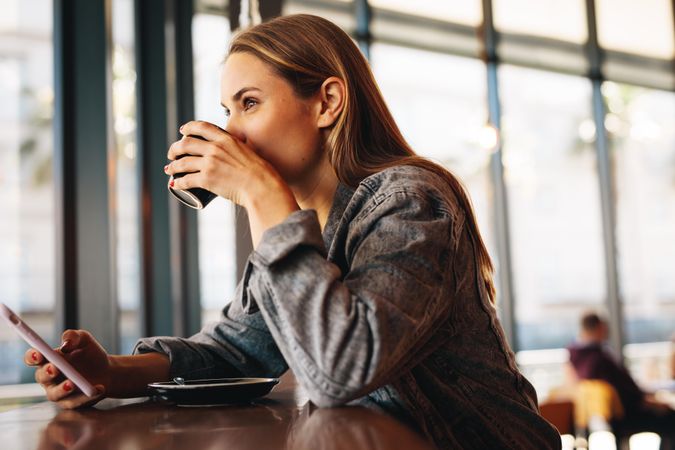 Female at a restaurant drinking coffee