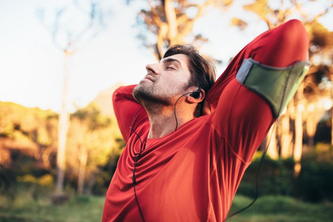 Man relaxing with closed eyes after workout