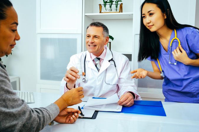 Female patient receiving medication for a cold in clinic