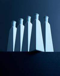 Tall bottles over dark background