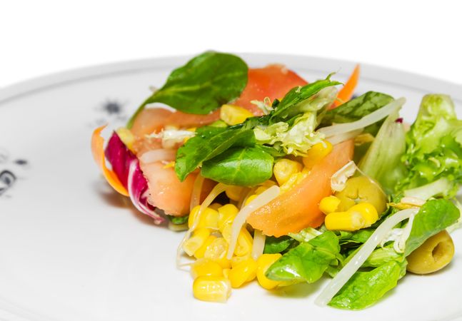 Fresh mediterranean style salad with corn and olives