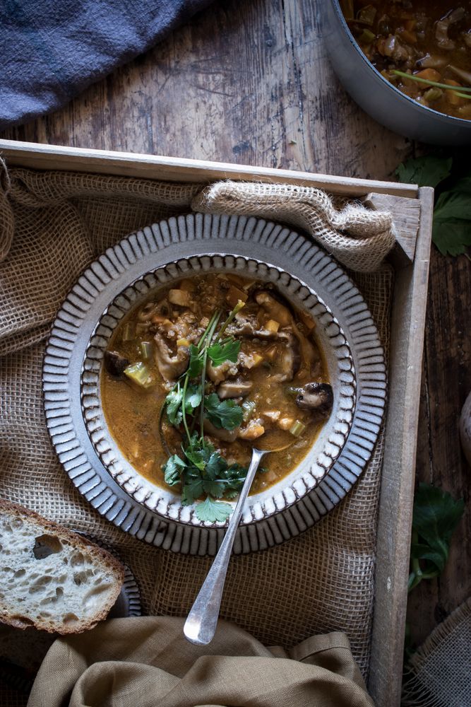 Bread and parsley near quinoa soup