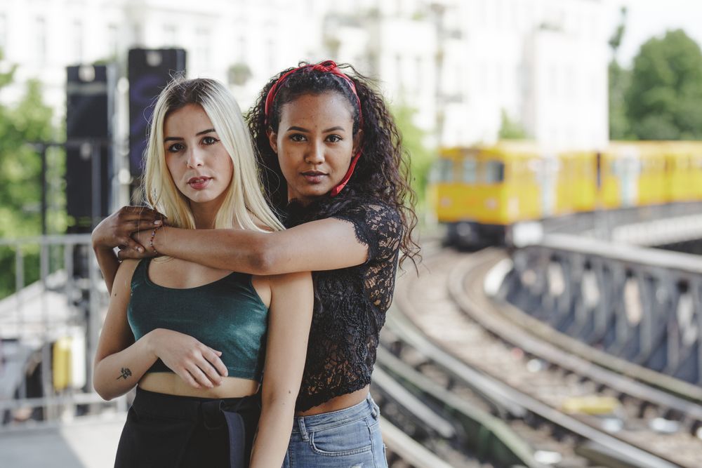 Friends standing on train platform
