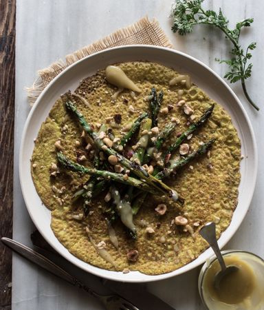 Served vegetarian crepe with oats and asparagus