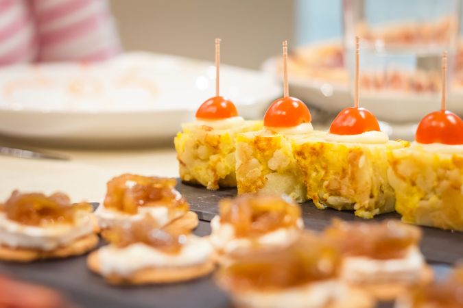 Spanish omelet tapas and cheese with onion pinchos
