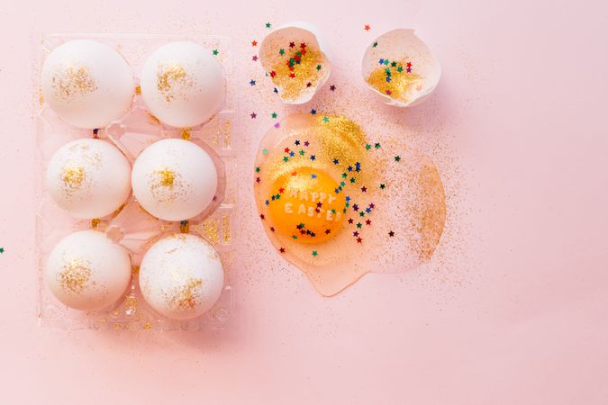 Decorated broken Easter egg on table