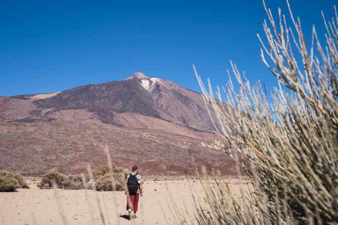 Man walking of mountain peak