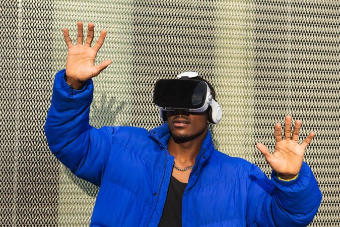 Black man experiencing virtual reality in city