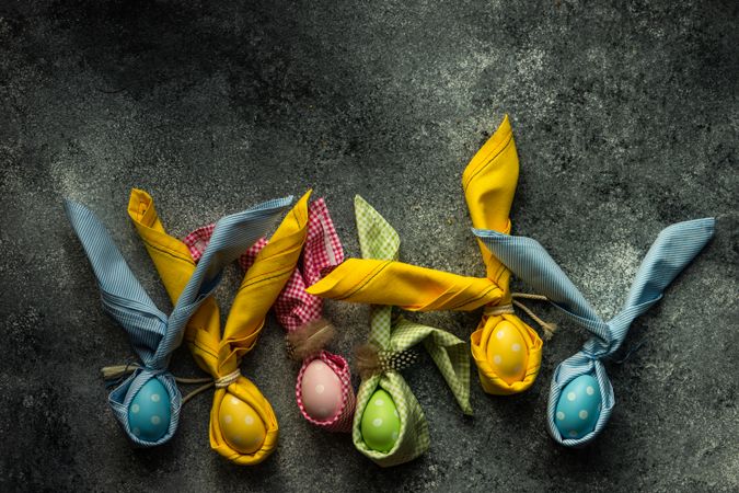 Colorful egg decorations on grey counter