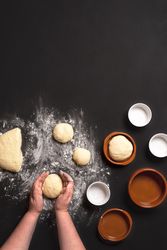 Hands kneading dough