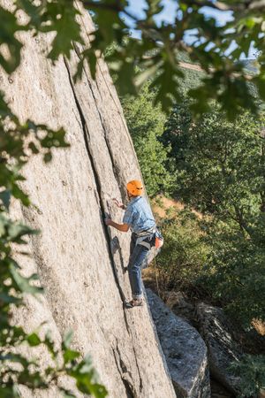 Free climber climbing in nature