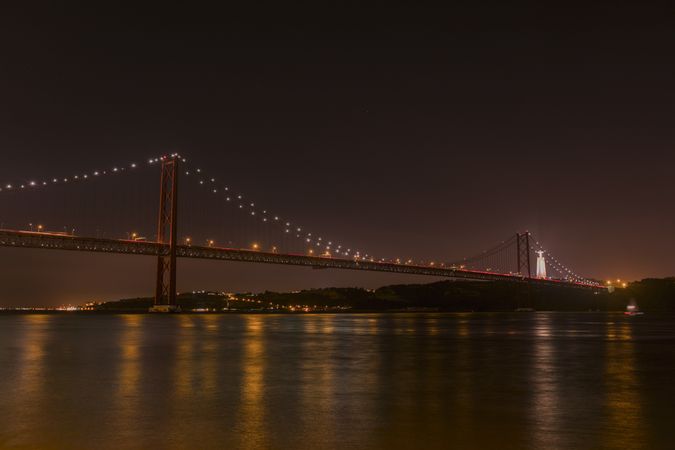 River and big illuminated bridge
