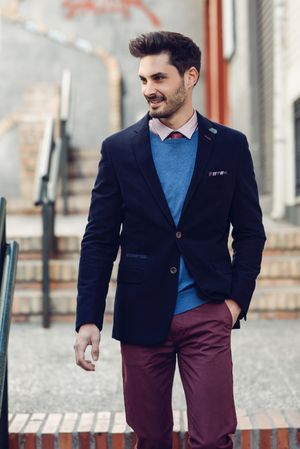 Smiling man in the street wearing elegant suit