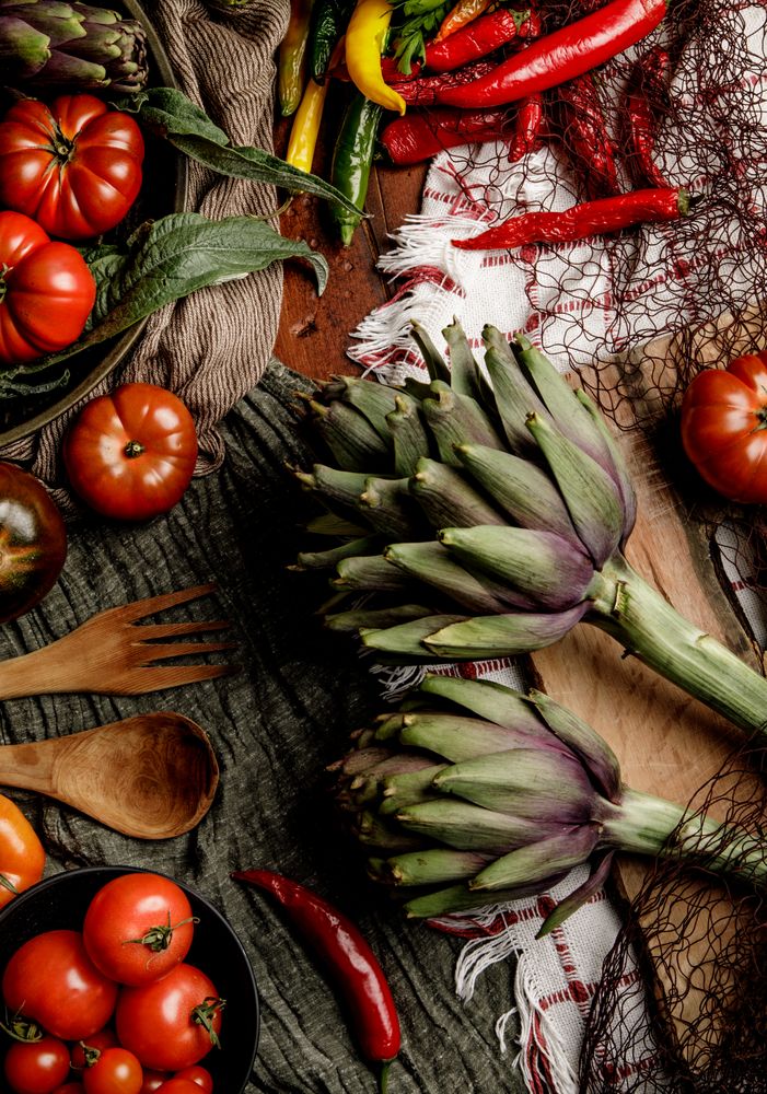 Assorted vegetables and napkins on table