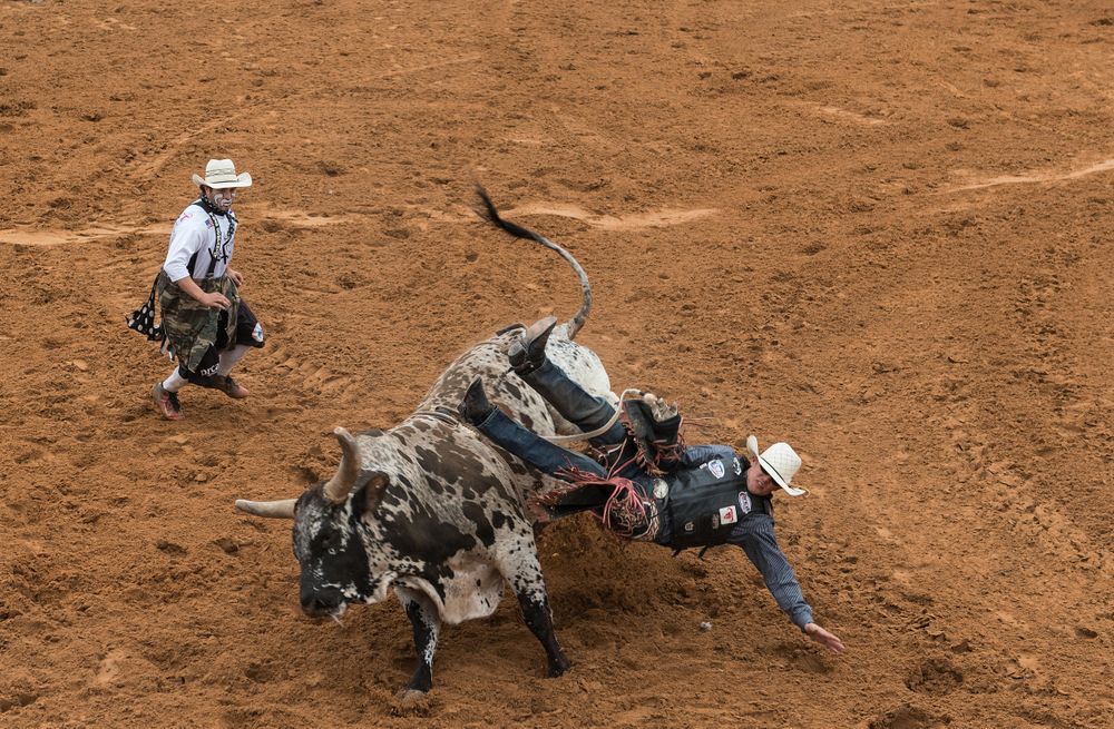A rodeo clown and bronc rider at the “Bad Company Rodeo,” Poteet, Texas