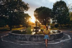 Female admiring sunset in park