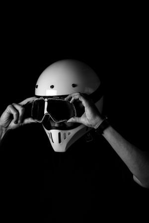 Rider in helmet and glasses at studio