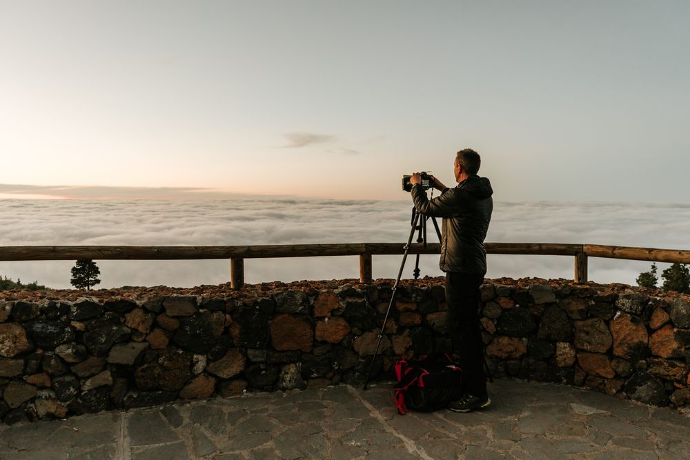 Photographer taking shot of hill view