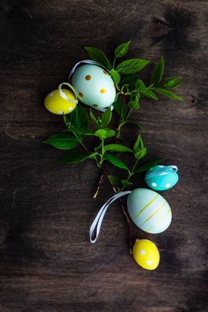Top view of spring time concept with colorful eggs on table