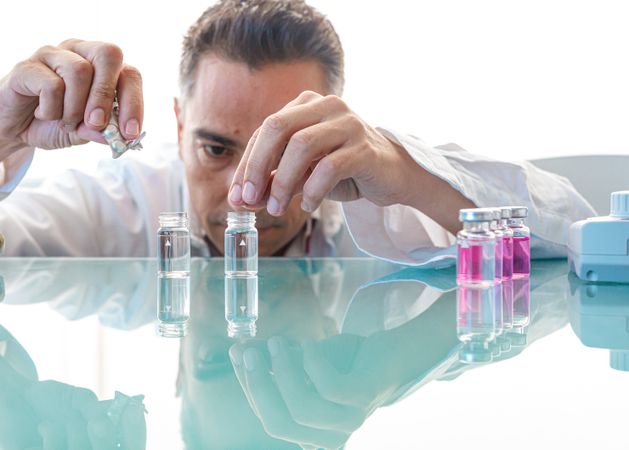 Assistant making test with samples in laboratory