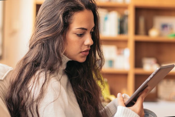 Connected Youth: A Young Woman Using a Tablet at Home